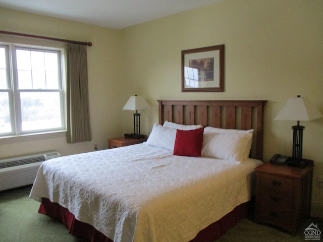 bedroom with radiator and carpet floors