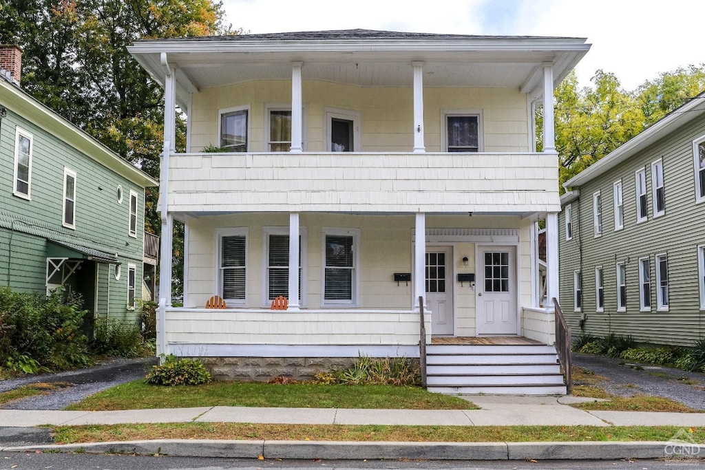 view of front of house with a balcony