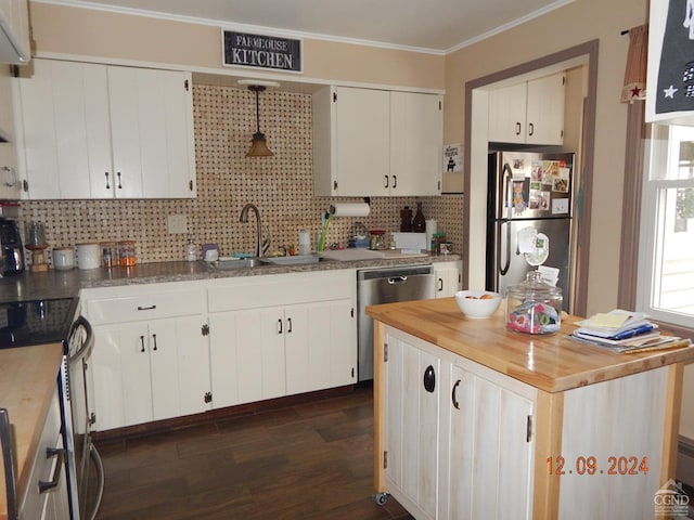 kitchen with white cabinets, crown molding, sink, dark hardwood / wood-style floors, and appliances with stainless steel finishes