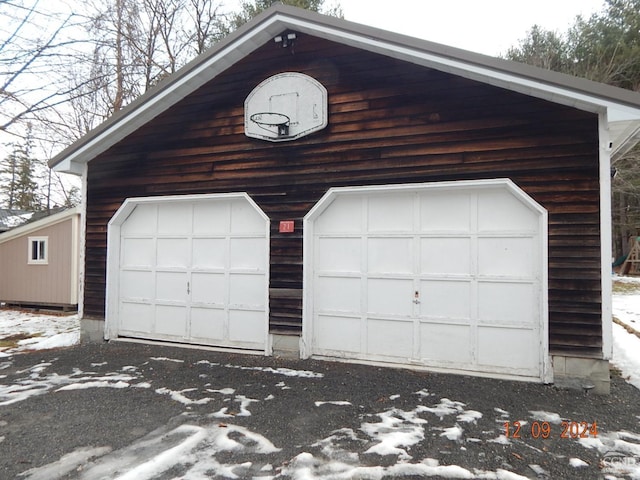 view of snow covered garage