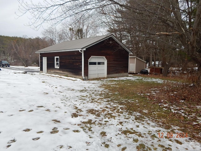 view of snow covered garage