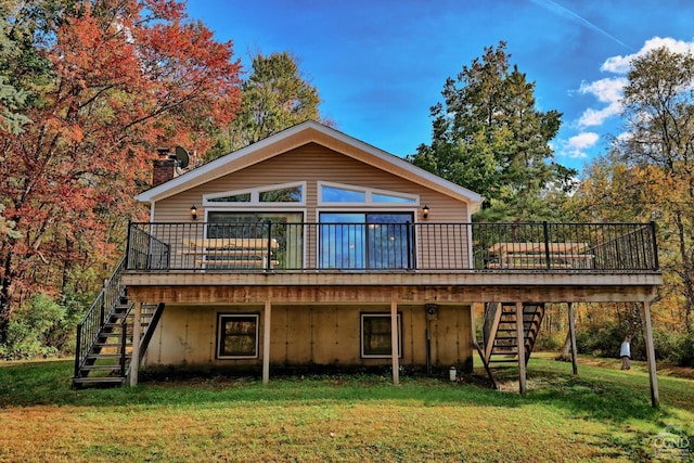 back of property with a lawn and a wooden deck