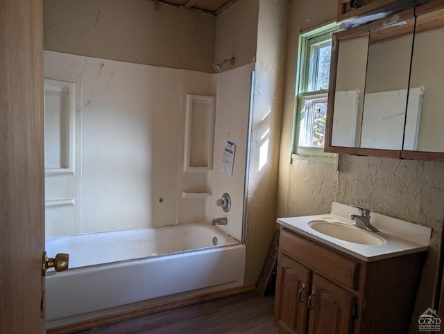 bathroom with vanity, shower / bath combination, and wood-type flooring