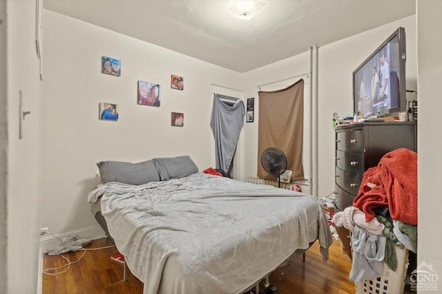 bedroom featuring dark hardwood / wood-style floors