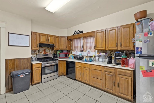 kitchen with backsplash, sink, light tile patterned flooring, and stainless steel appliances