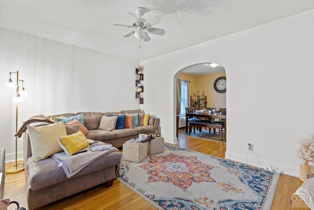 living room with hardwood / wood-style flooring and ceiling fan