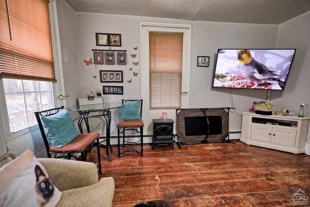 living room featuring dark hardwood / wood-style floors and baseboard heating