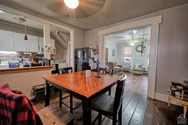 dining area with dark hardwood / wood-style flooring and ceiling fan