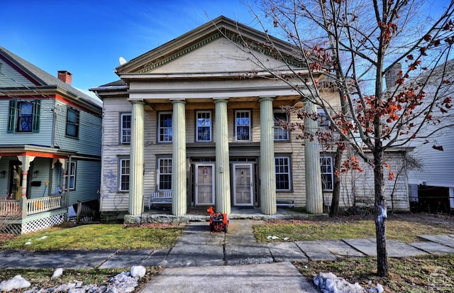 greek revival inspired property with covered porch