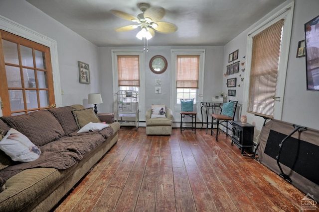 living room featuring ceiling fan and wood-type flooring