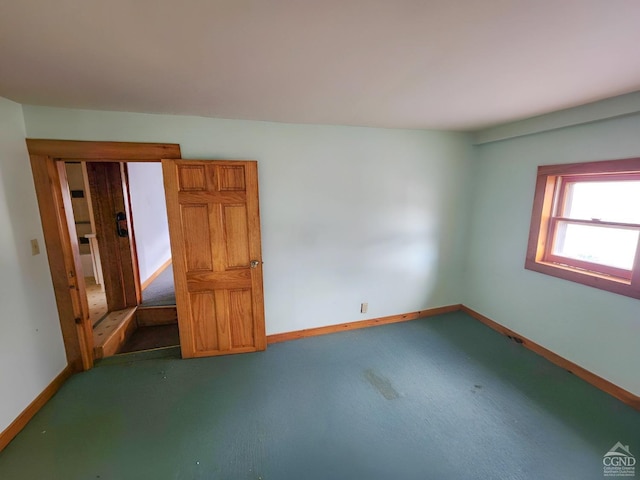 empty room with baseboards