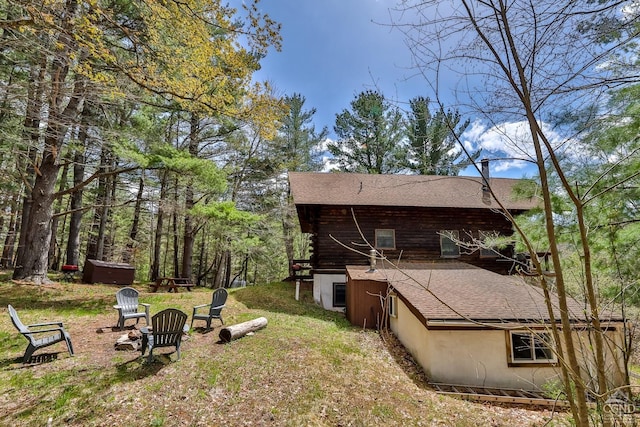 exterior space with an outdoor fire pit