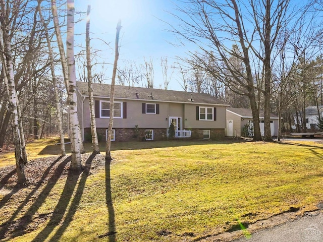 bi-level home with a front lawn