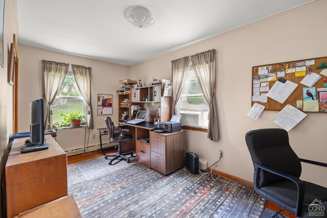 office with baseboard heating, cooling unit, and hardwood / wood-style flooring