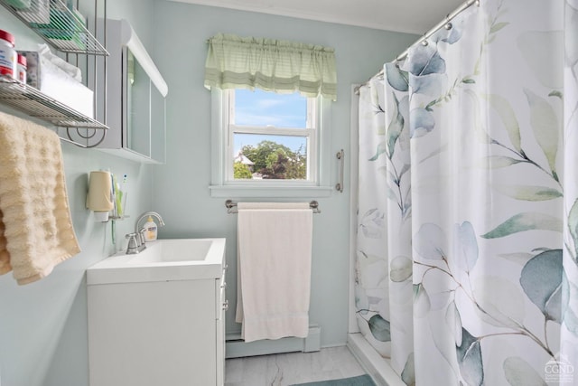 bathroom with a shower with shower curtain, vanity, and a baseboard radiator