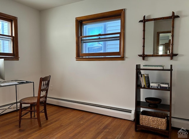 office area with hardwood / wood-style floors and baseboard heating