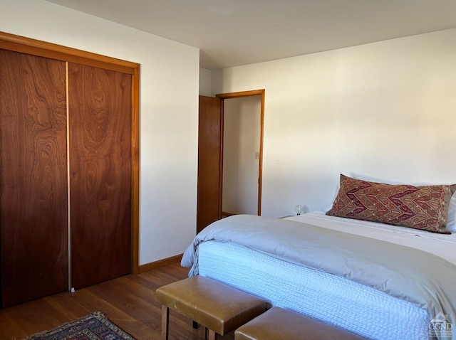 bedroom featuring hardwood / wood-style flooring and a closet