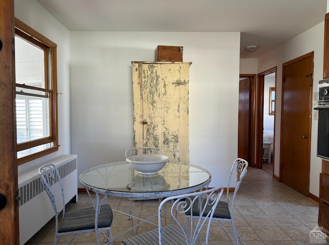 dining space featuring radiator heating unit