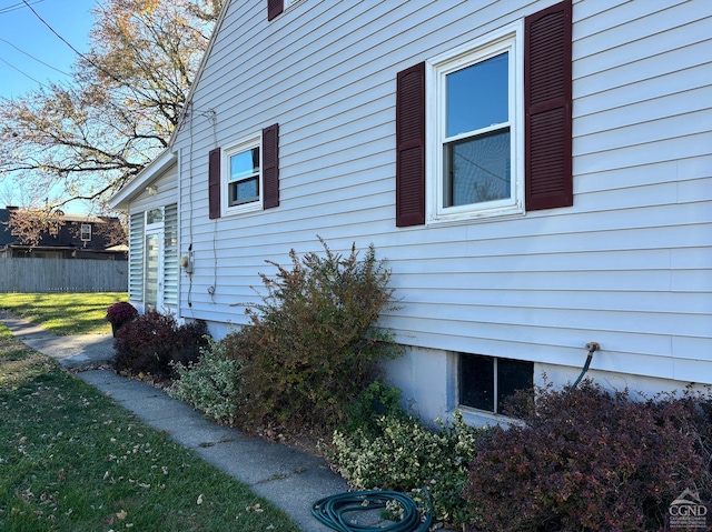 view of side of property featuring a yard