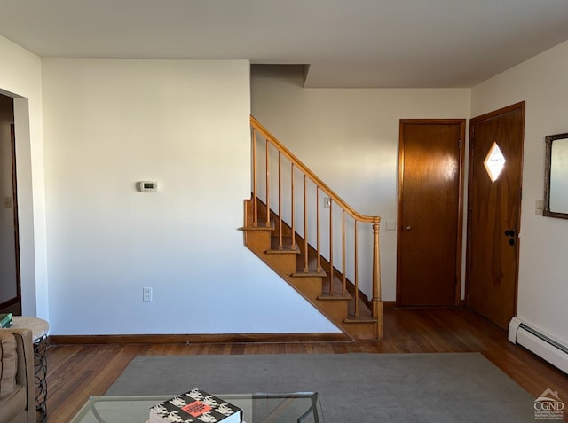 entryway featuring a baseboard heating unit and dark wood-type flooring