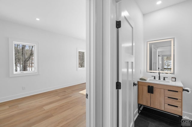 bathroom featuring wood-type flooring and vanity