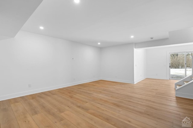 spare room with light wood-type flooring