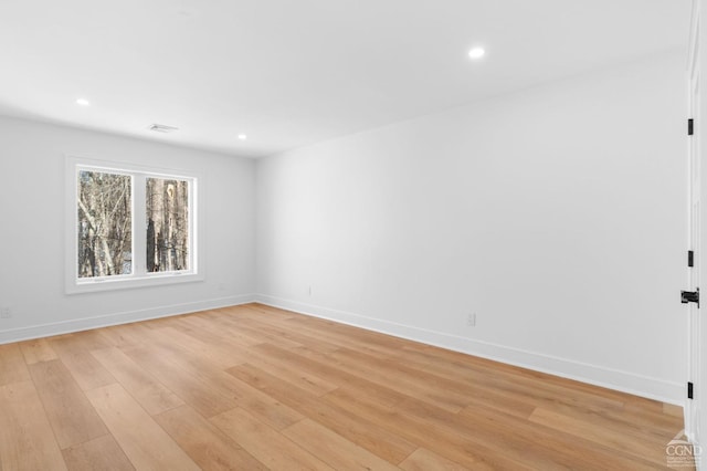 unfurnished room featuring light hardwood / wood-style floors