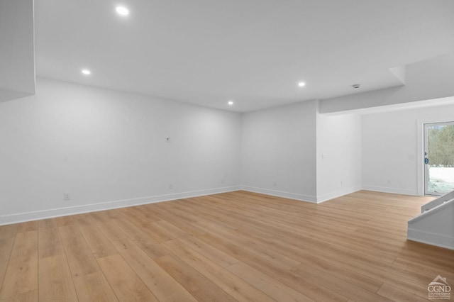 spare room featuring light hardwood / wood-style flooring