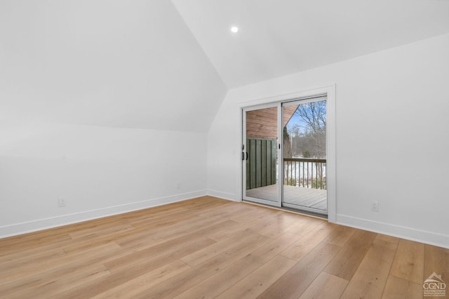 bonus room featuring light hardwood / wood-style floors and vaulted ceiling