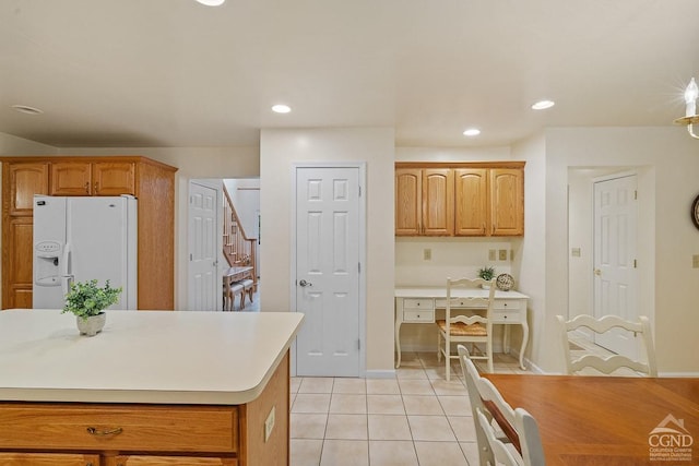 kitchen with light tile patterned flooring and white fridge with ice dispenser