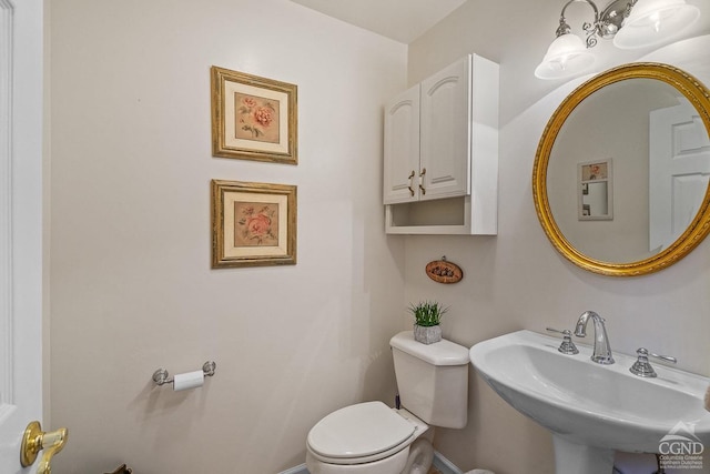 bathroom featuring sink and toilet