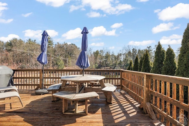 wooden terrace featuring outdoor dining space