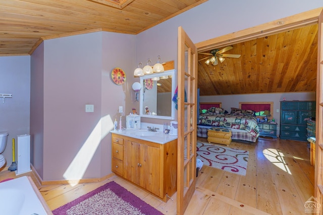 bathroom with hardwood / wood-style floors, vanity, wooden ceiling, and lofted ceiling