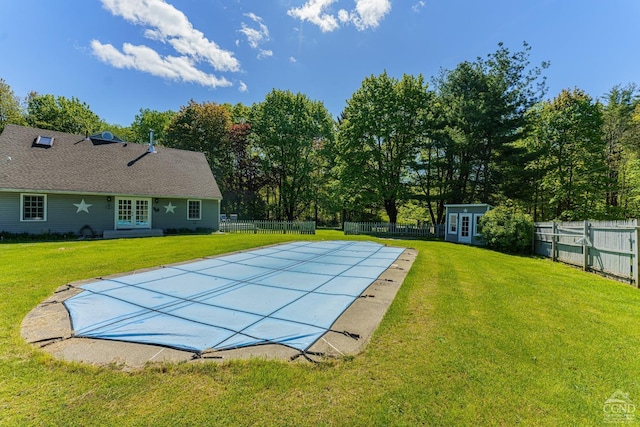 view of pool featuring a yard and a patio