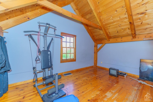 exercise area featuring wooden ceiling, light hardwood / wood-style flooring, and lofted ceiling