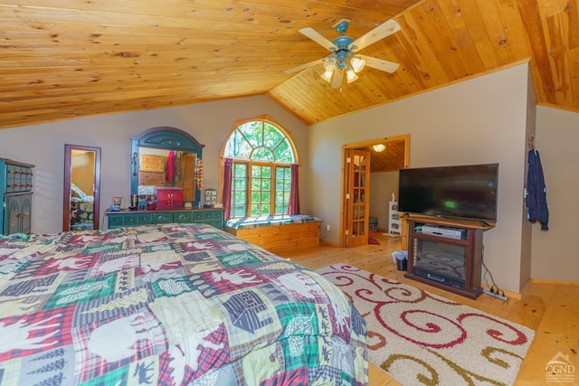 bedroom featuring ceiling fan, light hardwood / wood-style flooring, wood ceiling, and vaulted ceiling