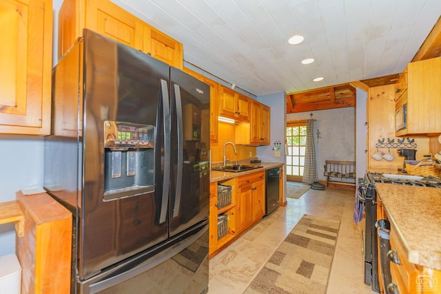 kitchen with sink and black appliances