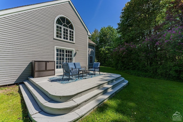 deck featuring a yard and an outdoor hangout area