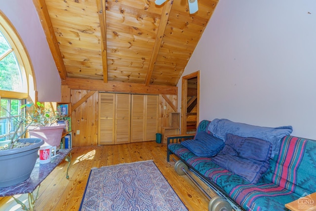 interior space featuring hardwood / wood-style floors, vaulted ceiling with beams, and wood ceiling