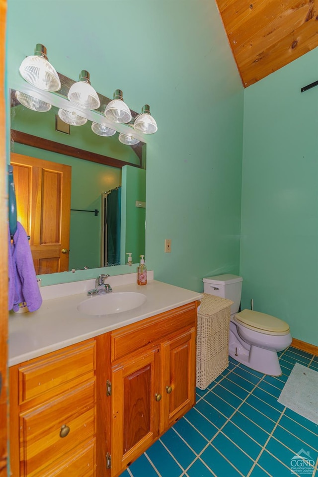 bathroom with walk in shower, tile patterned flooring, vanity, and toilet