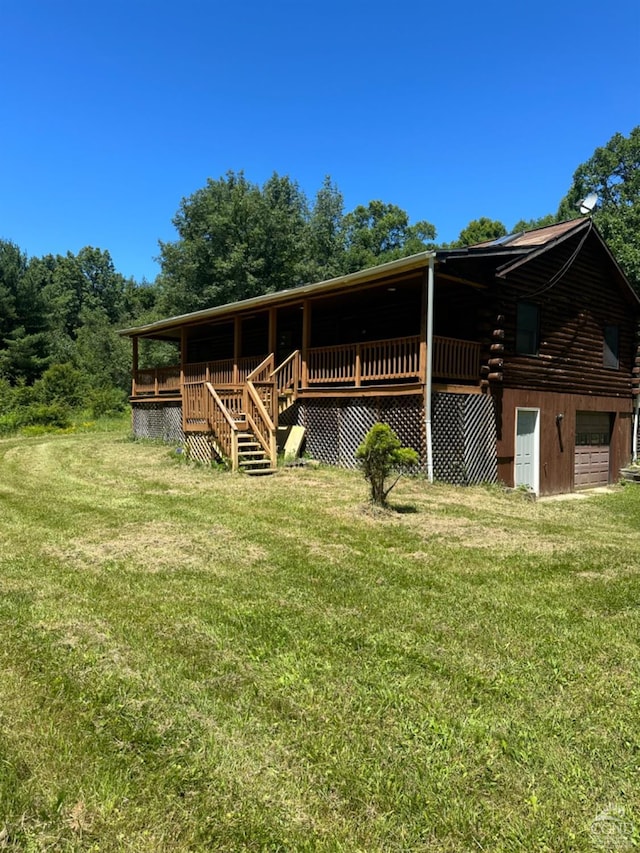 exterior space featuring a lawn and a garage