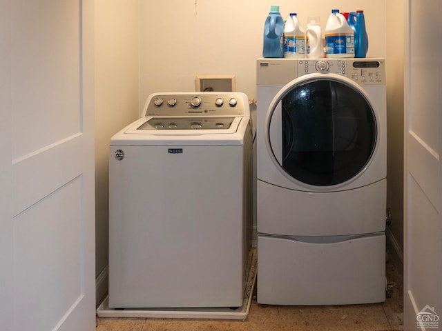 laundry room with independent washer and dryer