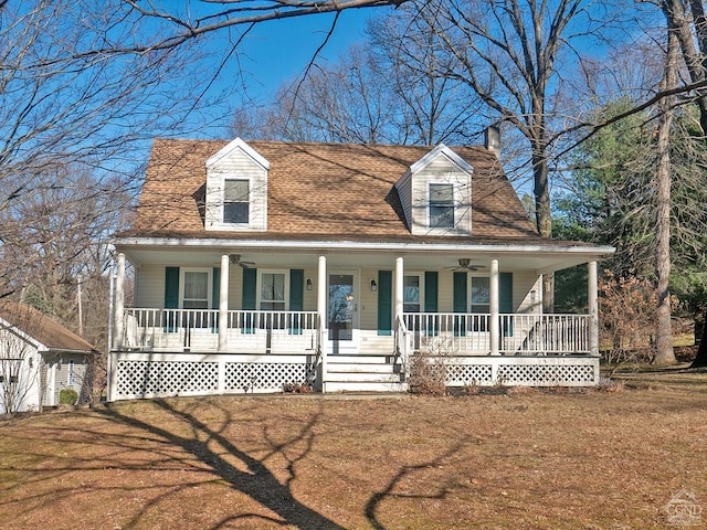 view of front of house with a porch and a front lawn