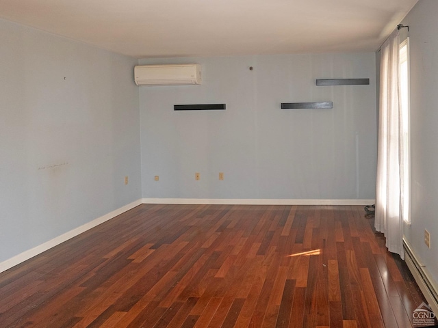 empty room featuring dark hardwood / wood-style flooring, a wall mounted AC, and a baseboard heating unit