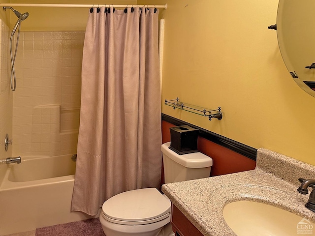 full bathroom featuring shower / bath combo with shower curtain, vanity, and toilet