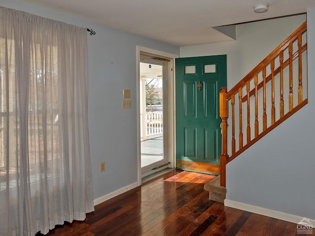 foyer entrance with dark wood-type flooring