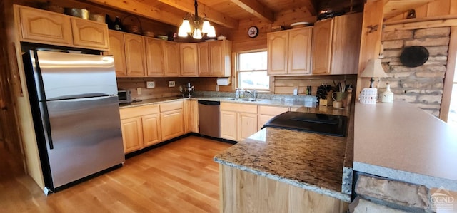 kitchen with light wood-type flooring, light brown cabinetry, appliances with stainless steel finishes, beamed ceiling, and decorative light fixtures