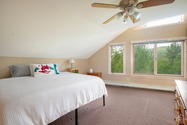 carpeted bedroom with ceiling fan, vaulted ceiling, and a baseboard heating unit