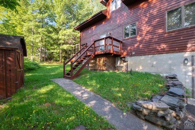 view of yard with a storage unit and a wooden deck