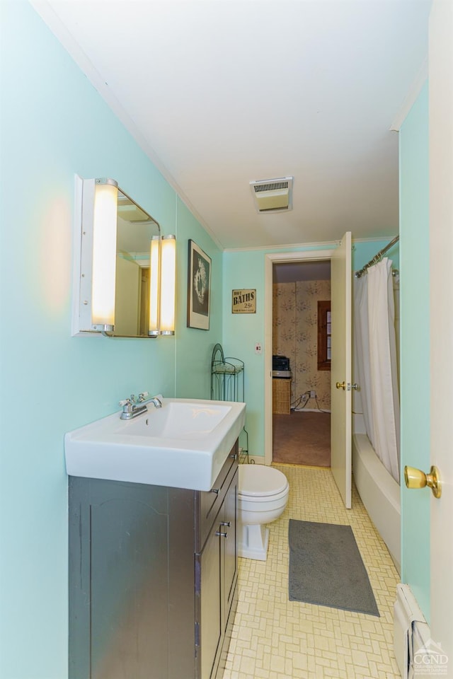 full bathroom featuring vanity, a baseboard radiator, toilet, and shower / tub combo with curtain